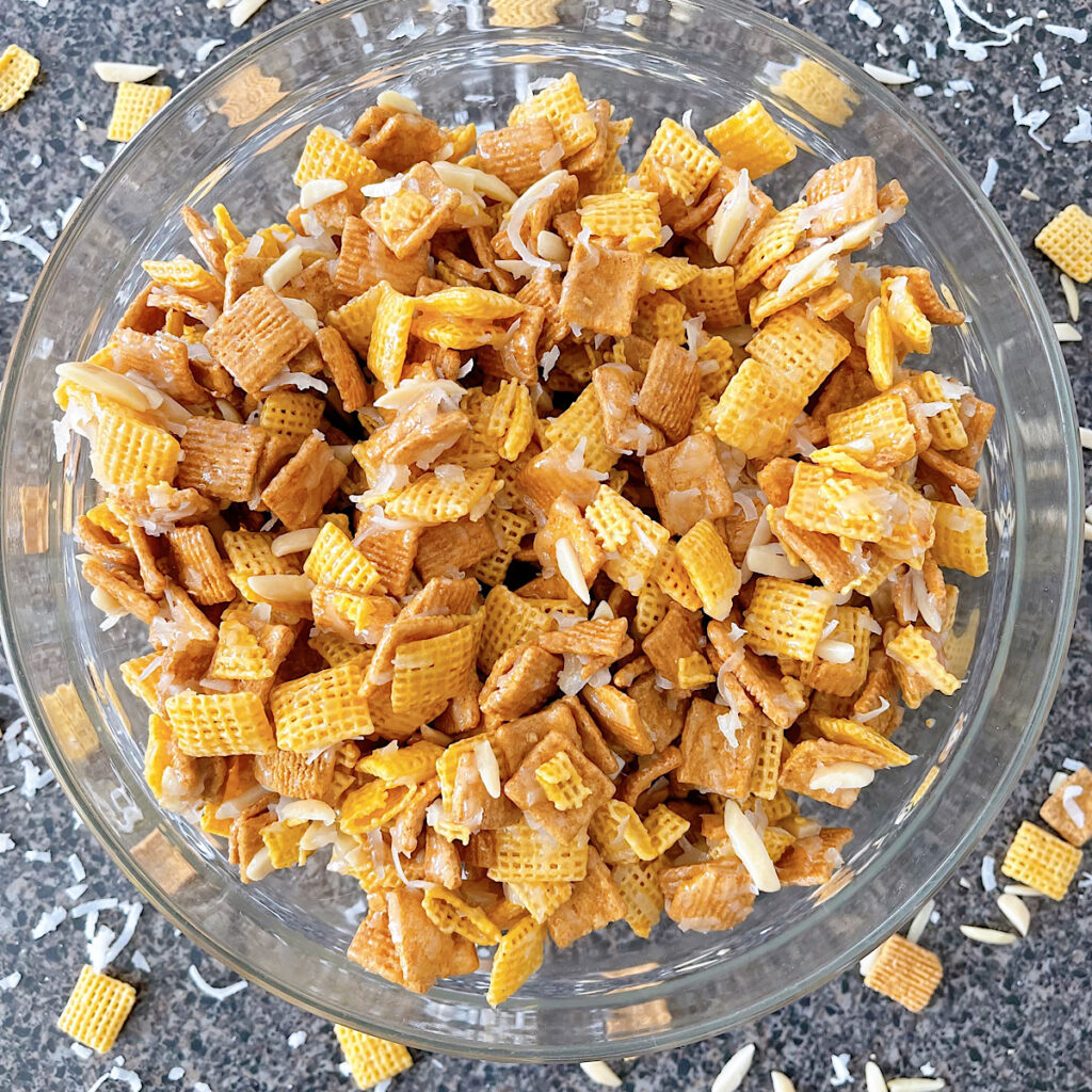 A bow of Christmas Crack Chex Mix.