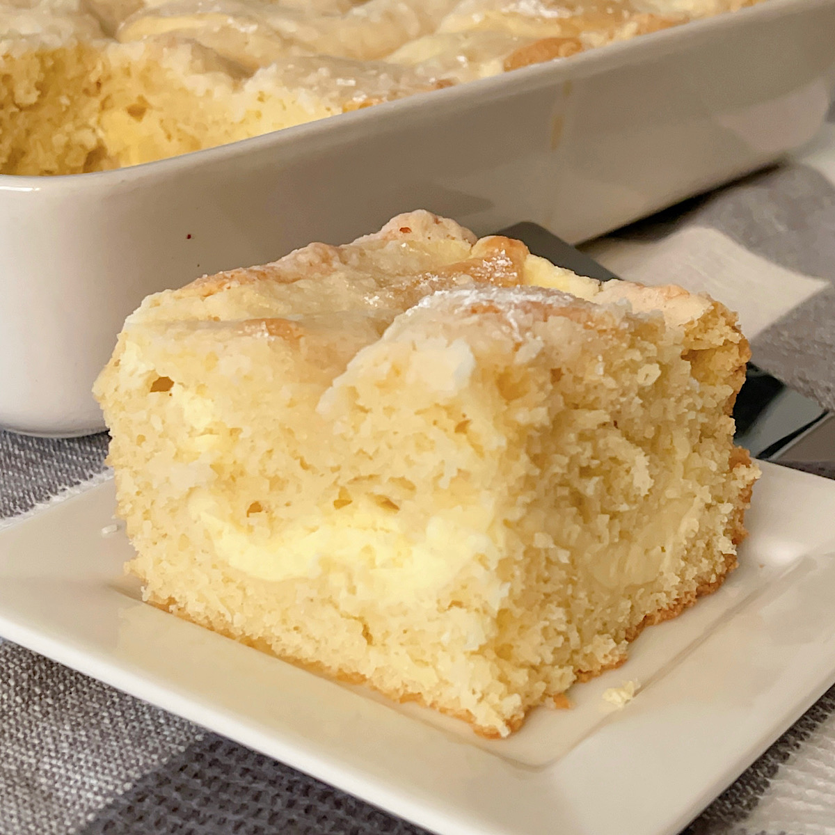 A slice of cream cheese coffee cake.
