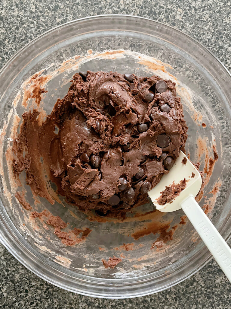 Brownie mix cookie dough in a glass bowl.