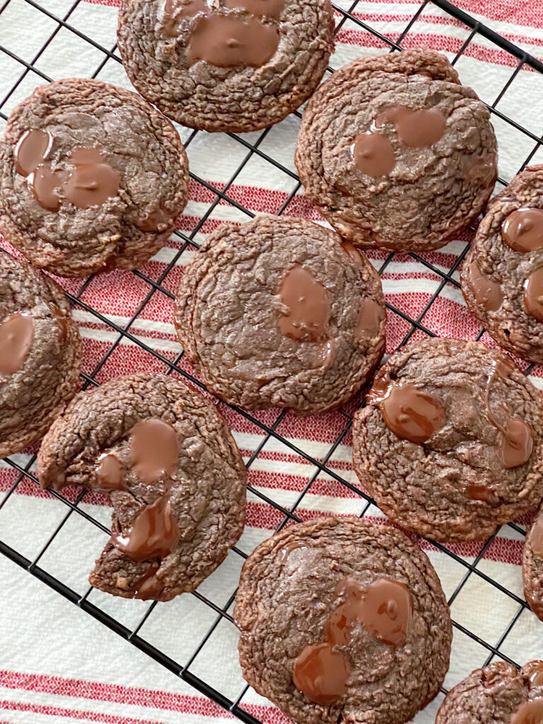 Brownie cookies on a wire rack.
