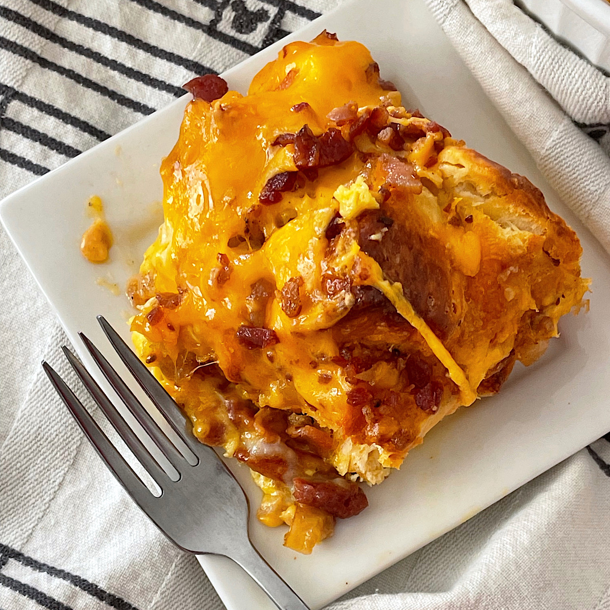A serving of bacon, egg & cheese biscuit bake.