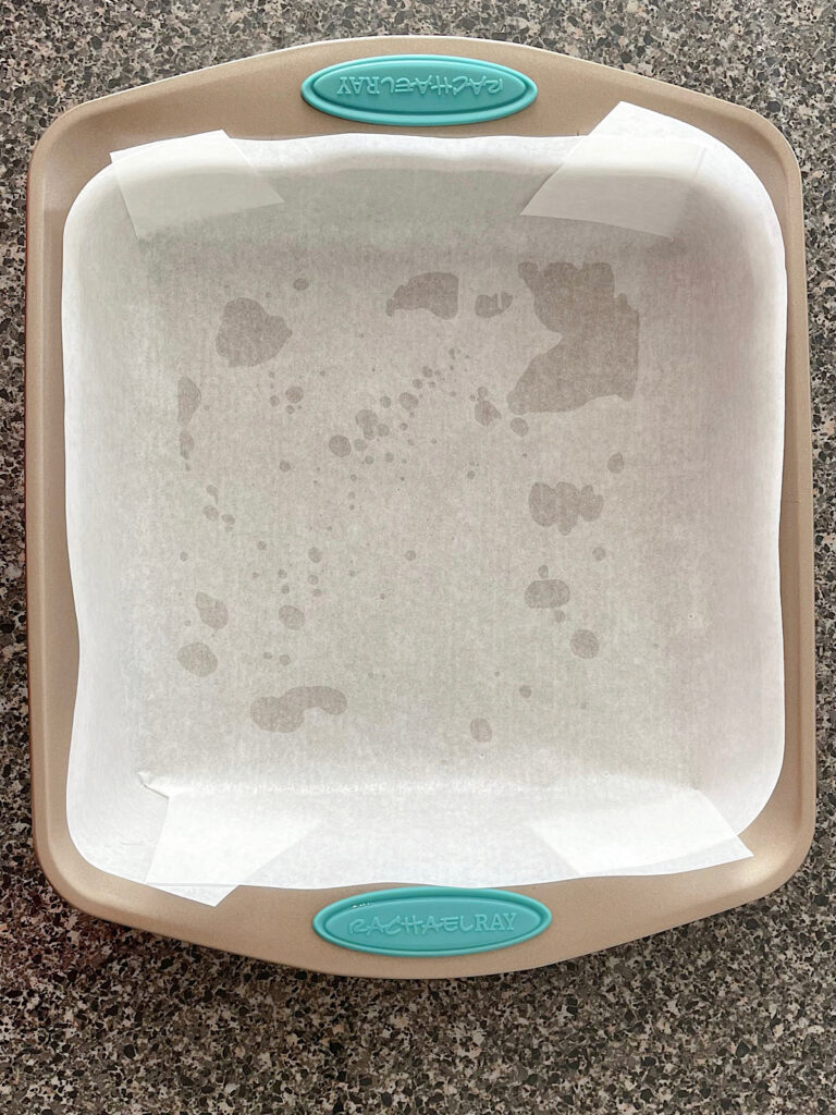 Parchment paper in a square pan.