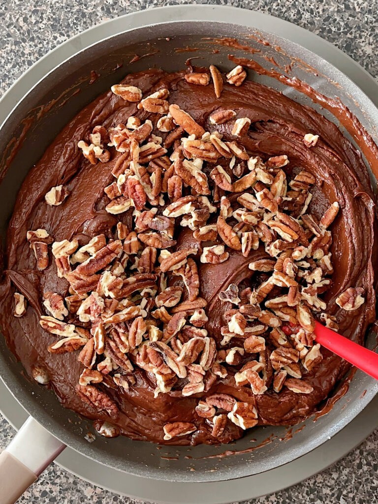 Fudge and pecans in a pan.