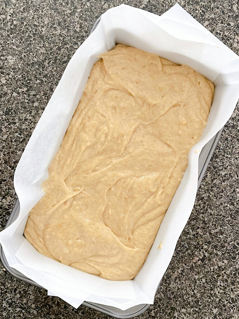 Sourdough banana bread batter in a loaf pan.
