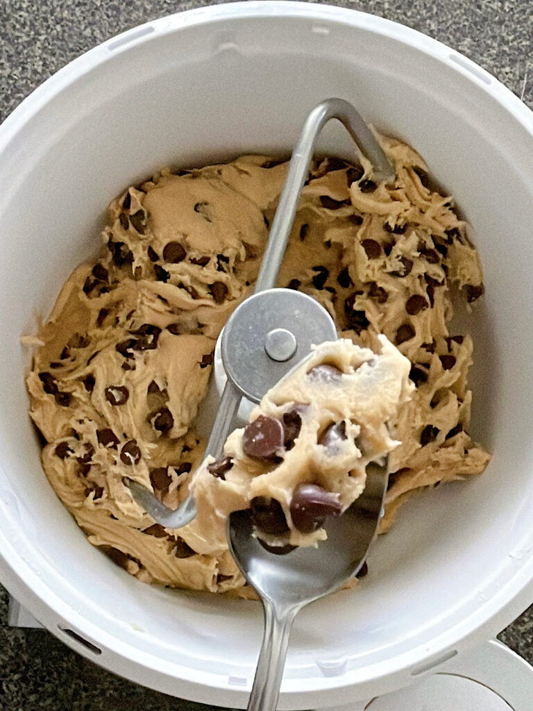 Sourdough chocolate chip cookie dough in a stand mixer.