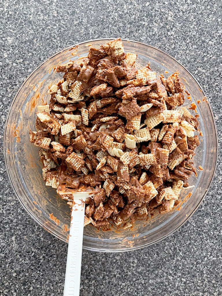 Melted chocolate mixed with Rice Chex cereal.