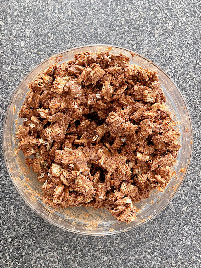 A bowl of Butterfinger Muddy Buddies without powdered sugar.