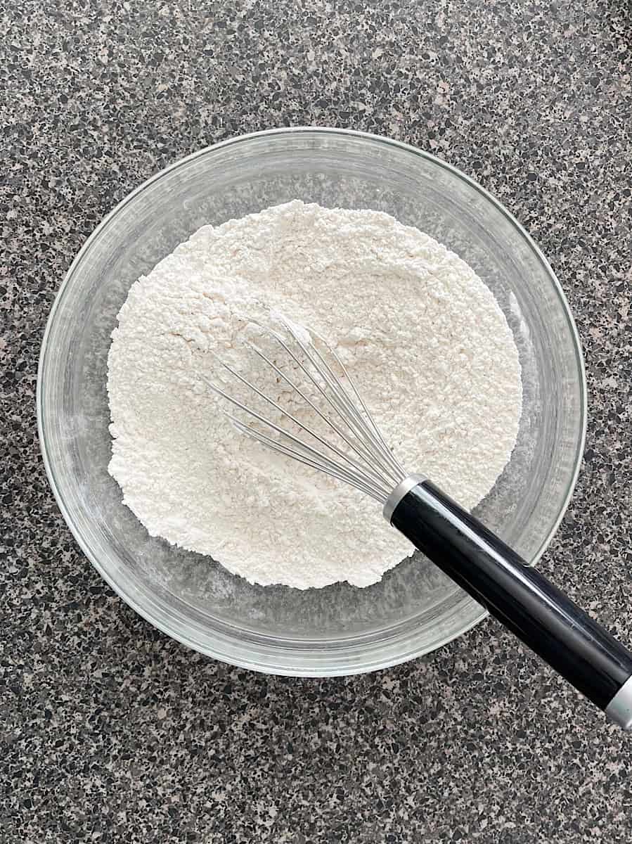 Dry ingredients in a glass mixing bowl.