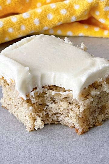 A banana bread bar with cream cheese frosting.