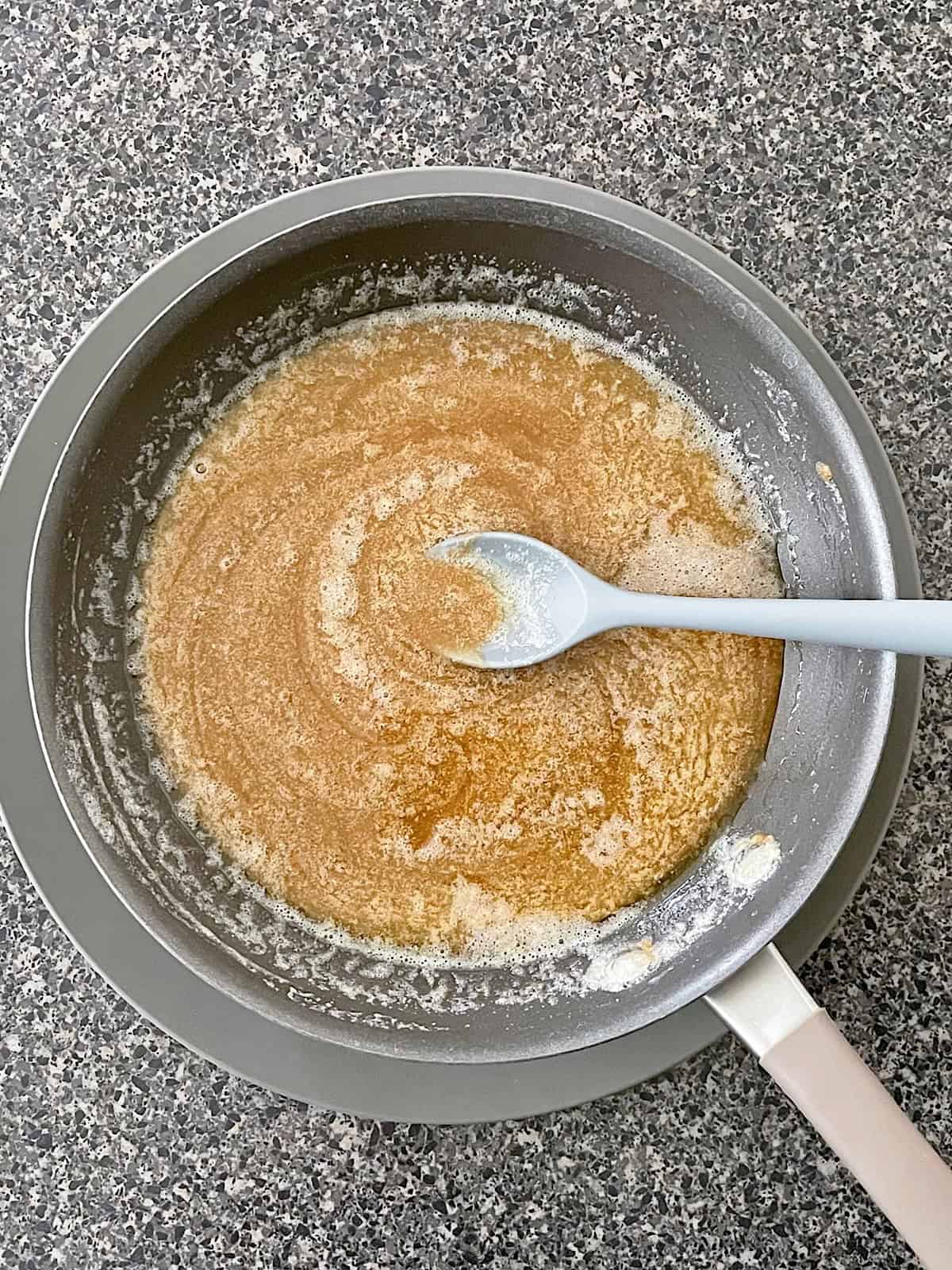 Melted butter, brown sugar, and corn syrup in a pan.