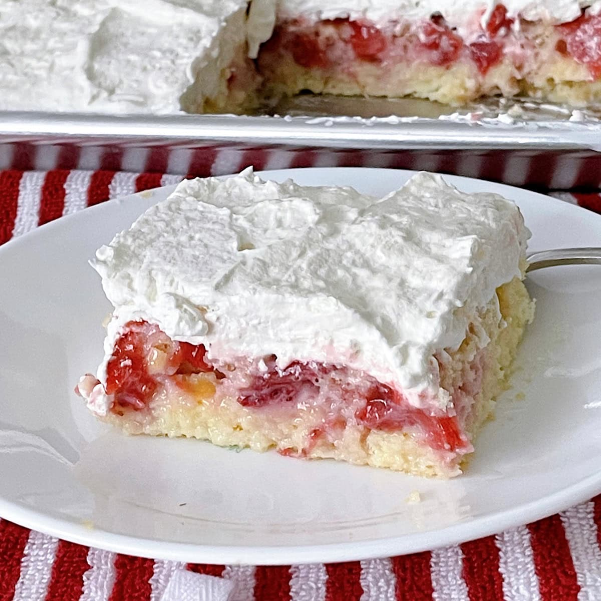 A slice of strawberry cream cake.