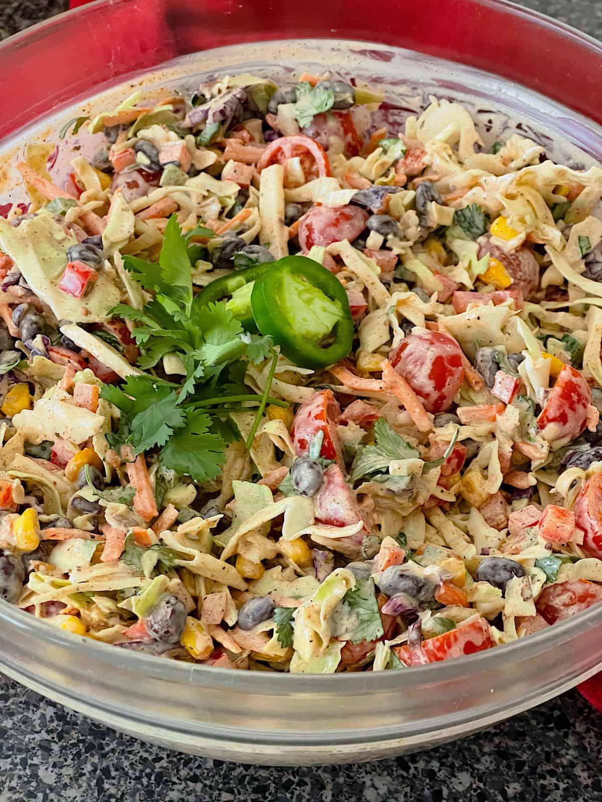 A clear bowl of Mexican coleslaw.