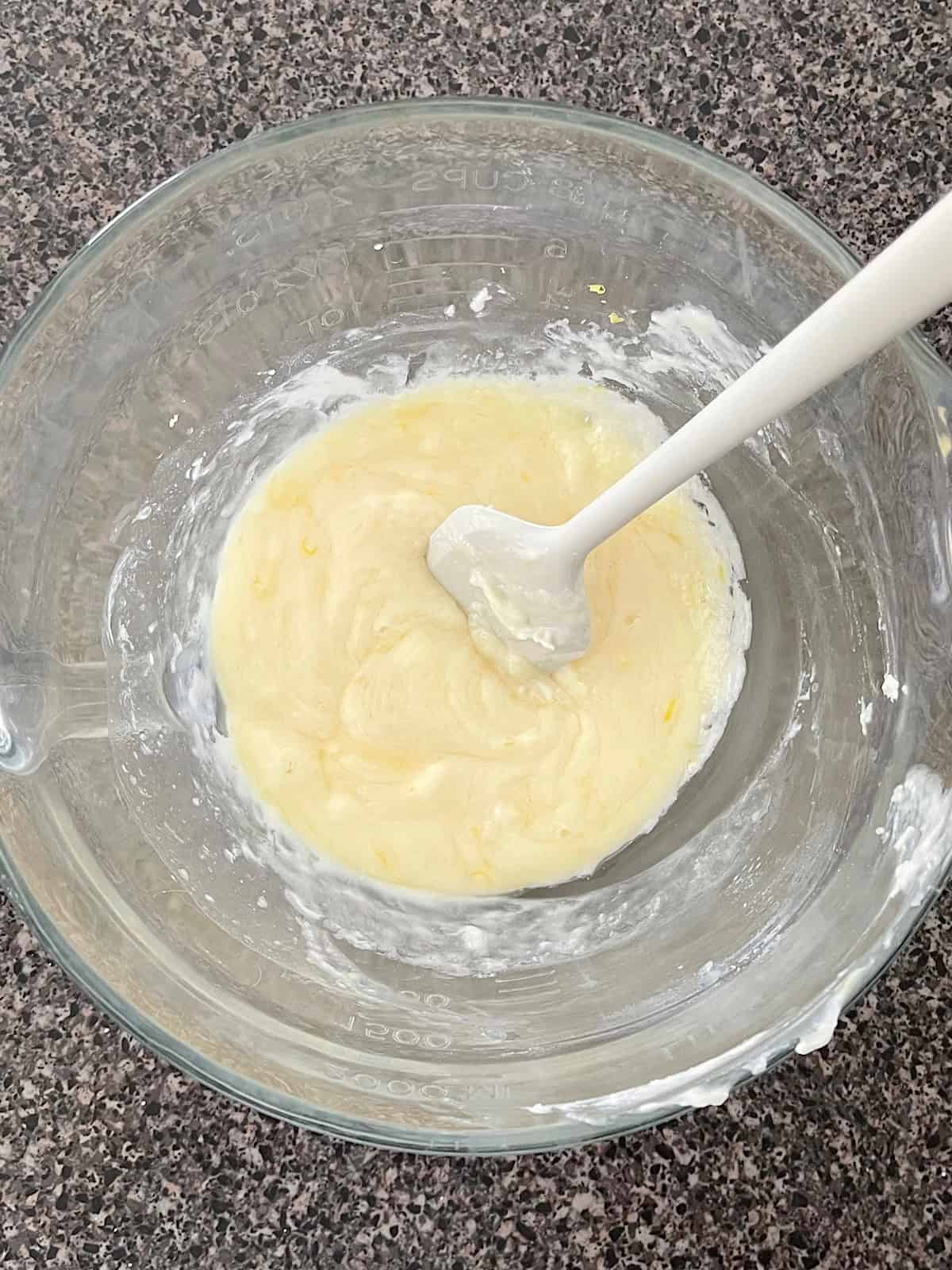 A bowl of melted white chocolate.
