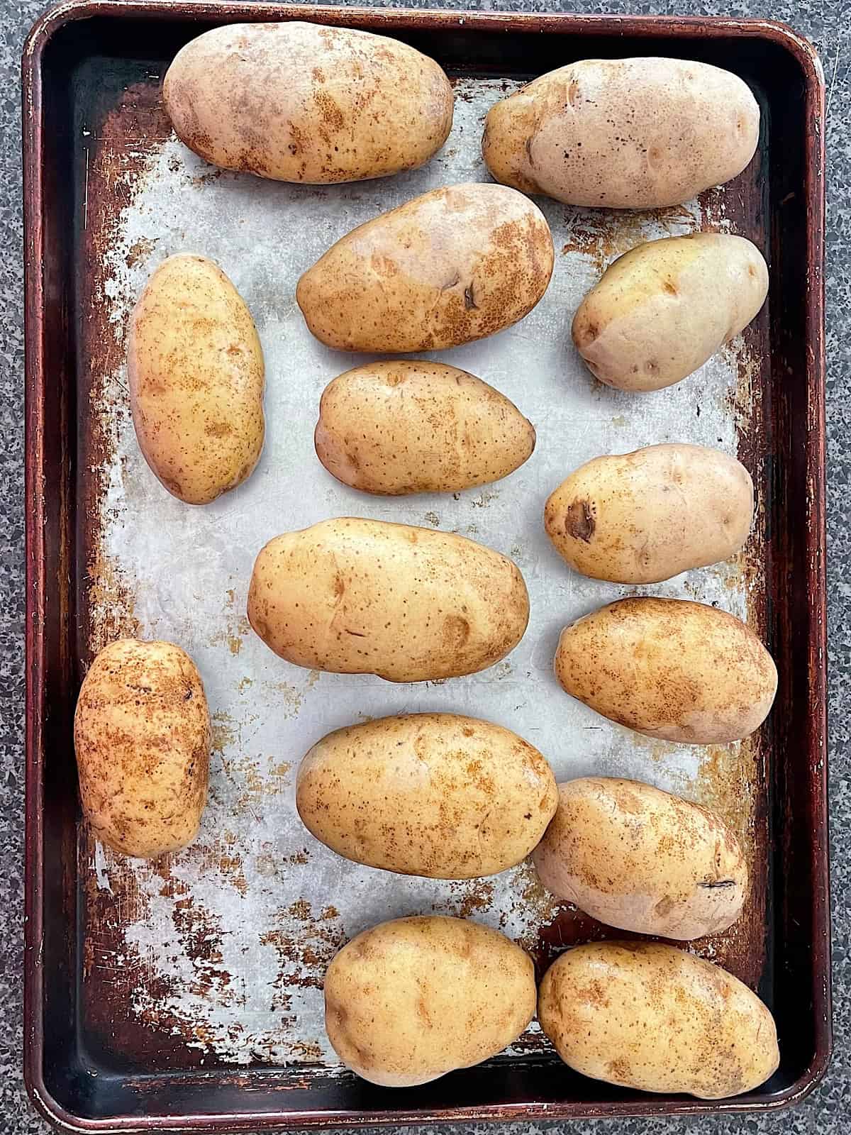 Potatoes on a baking sheet.