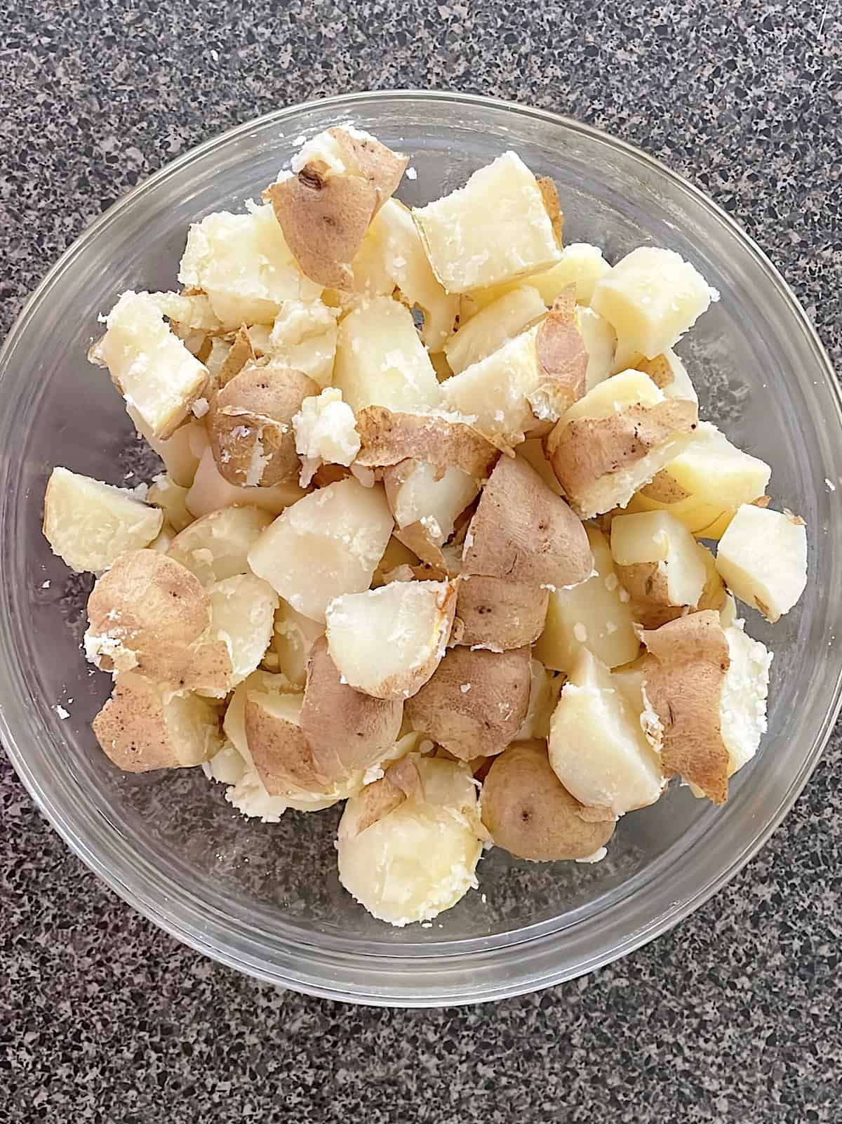 Diced potatoes in a mixing bowl.