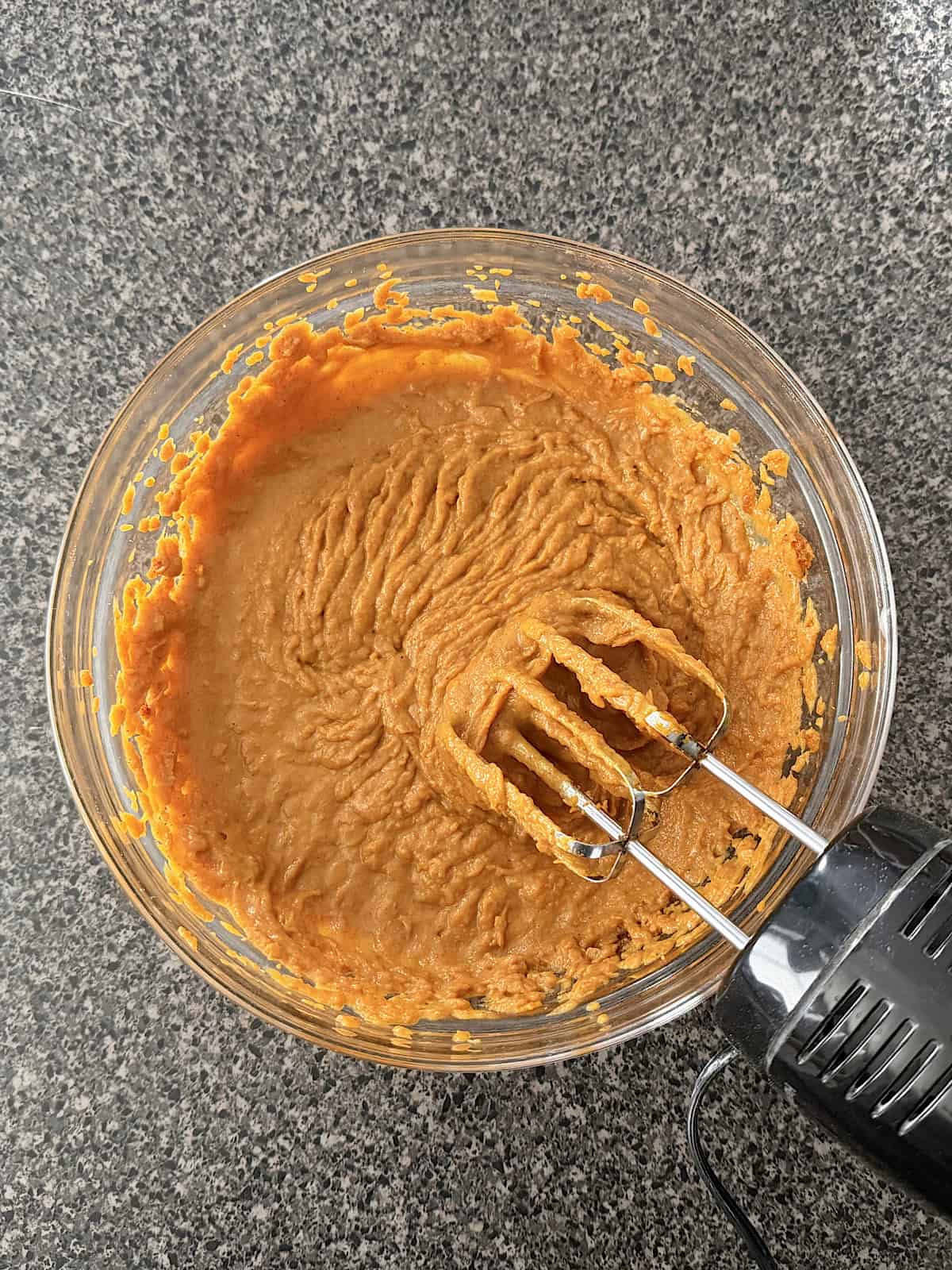 Pumpkin pie filling in a mixing bowl.