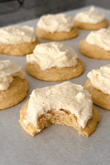 Eggnog cookies with eggnog frosting on a baking sheet.