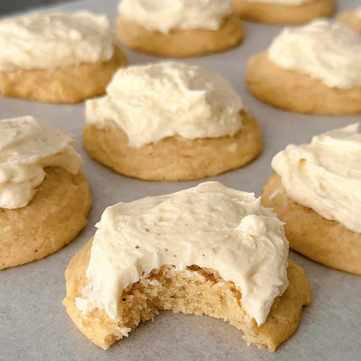 Eggnog cookies with eggnog frosting on a baking sheet.