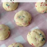 Christmas Sugardoodle Cookies on parchment paper with a Christmas plaid background.
