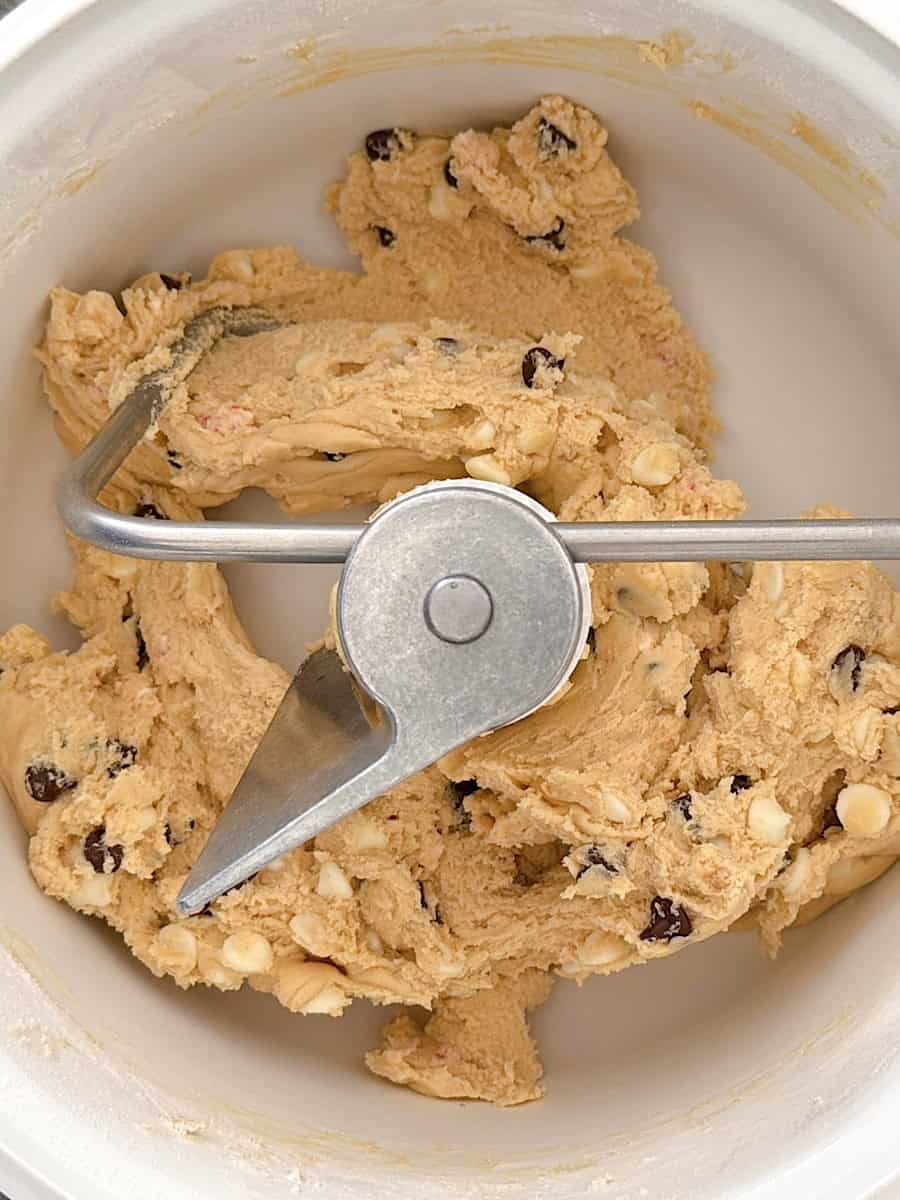White chocolate peppermint cookie dough in a stand mixer.