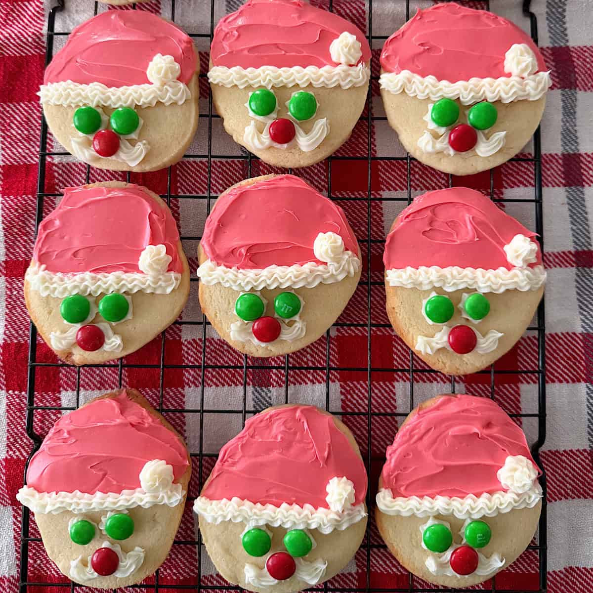 A round sugar cookie decorated to look like Santa.
