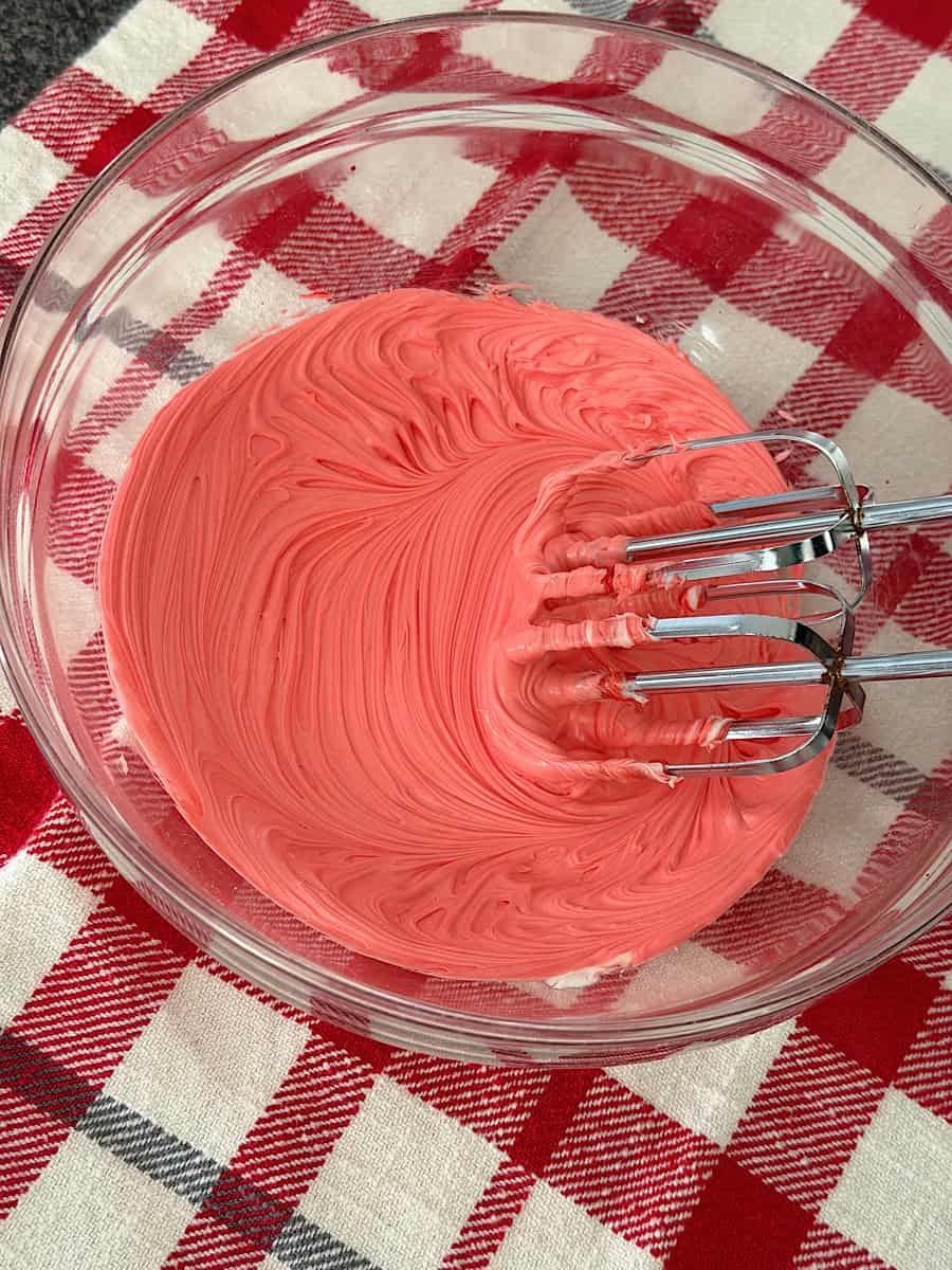 A bowl of red frosting.