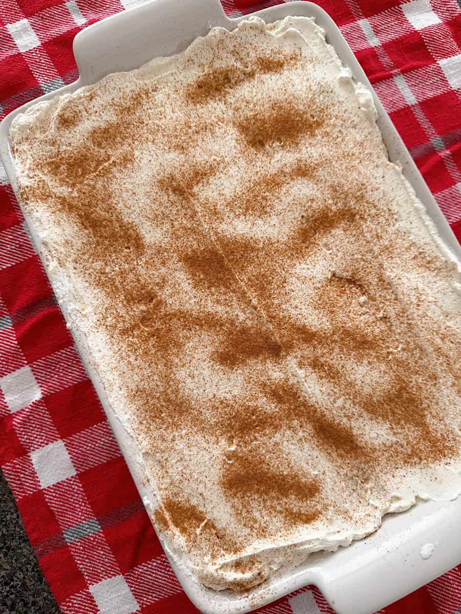 Eggnog Tres Leches Cake in a white baking dish.