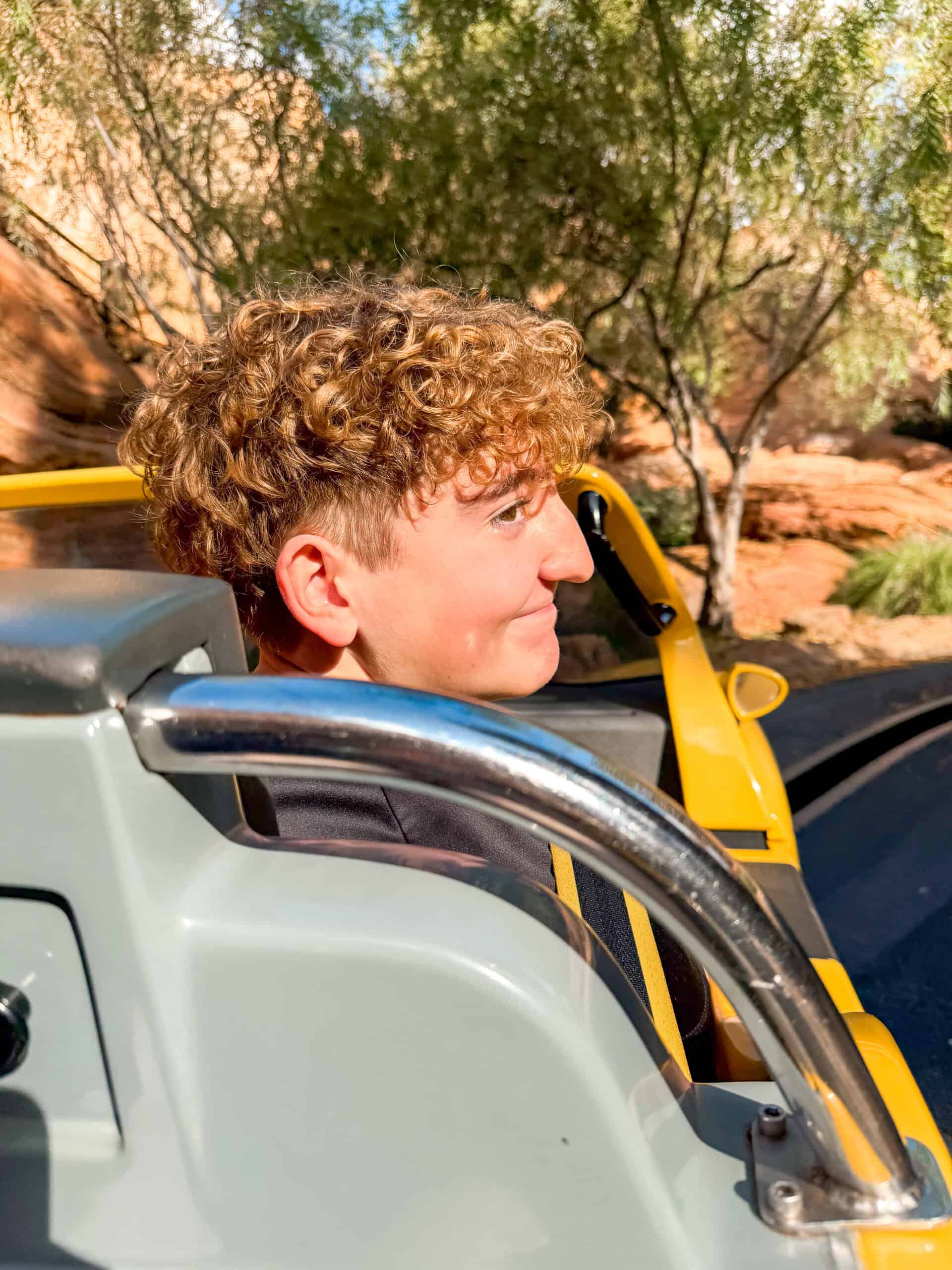 A teenager riding Radiator Springs Racers at Disneyland.