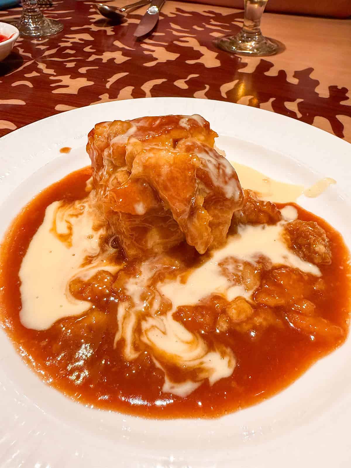 Caramel Bread Pudding with Vanilla Sauce from Storyteller's Cafe.